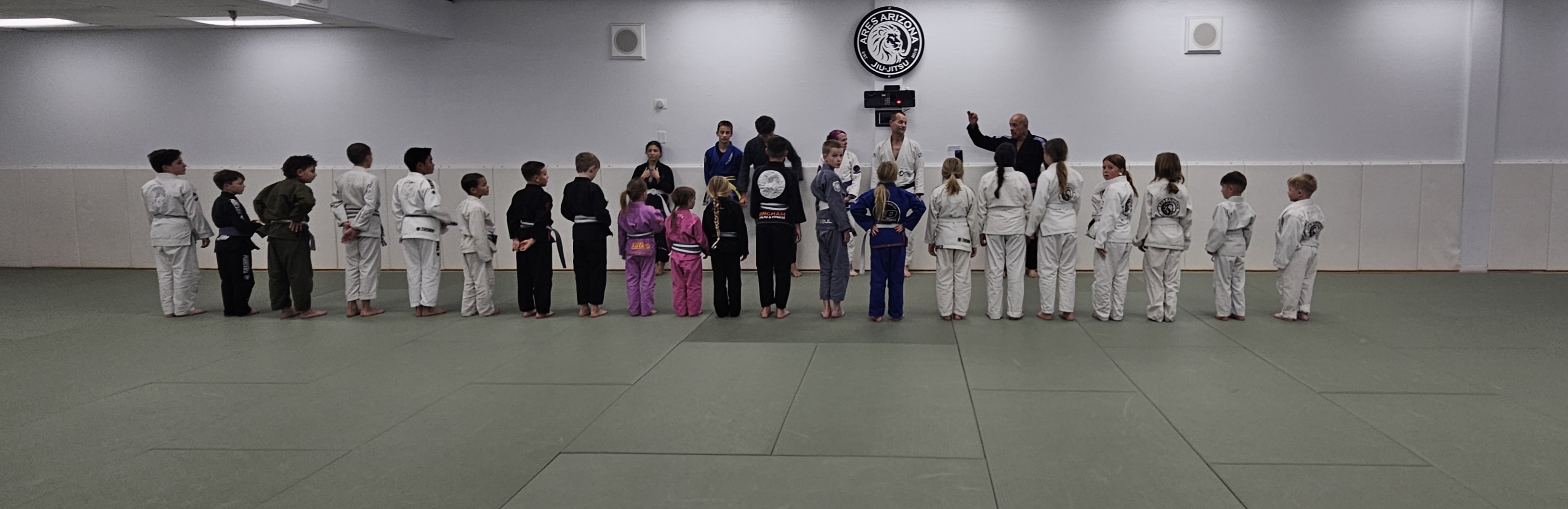 Kids lined up across the mat Ares Arizona